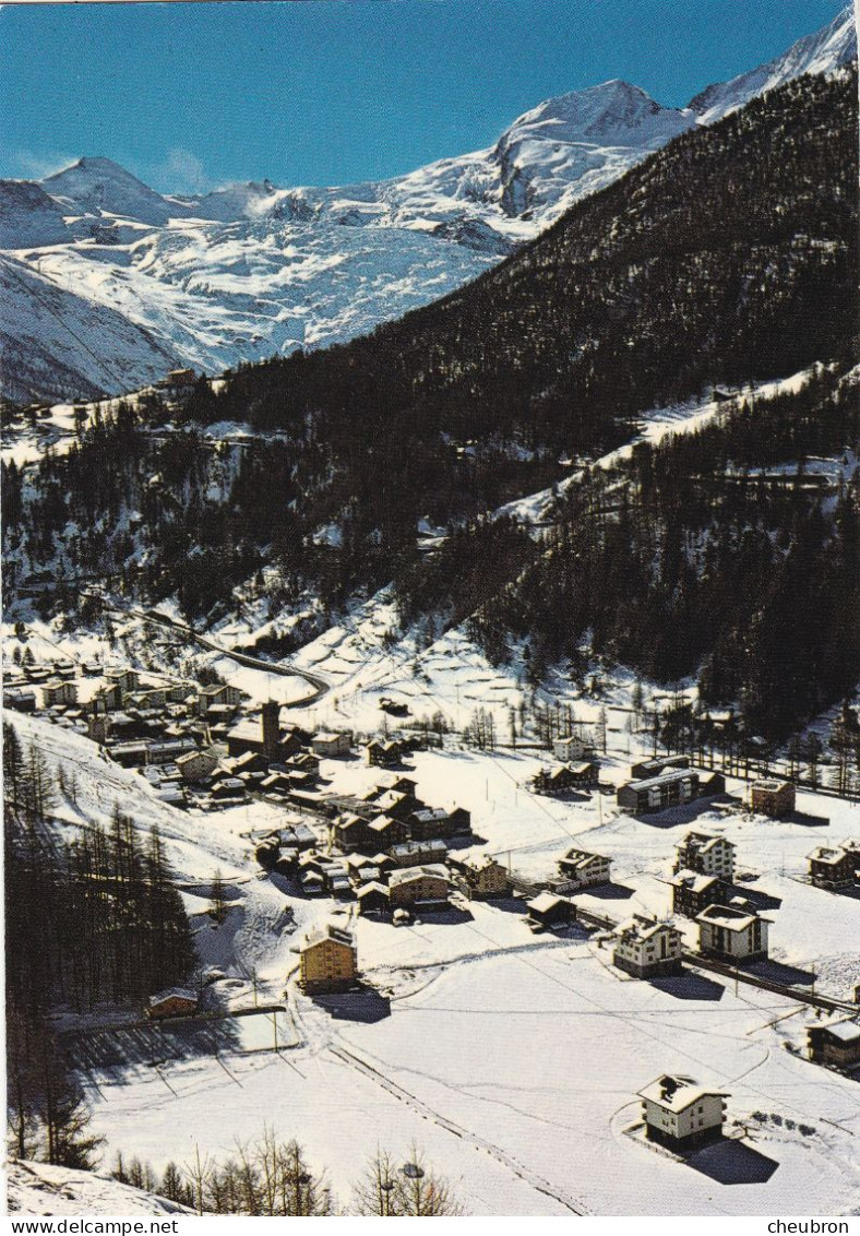 SUISSE .CPSM. SAAS-GRUND. VUE GENERALE AERIENNE EN HIVER. ANNEE 1977 + TIMBRE + TEXTE - Saas-Grund