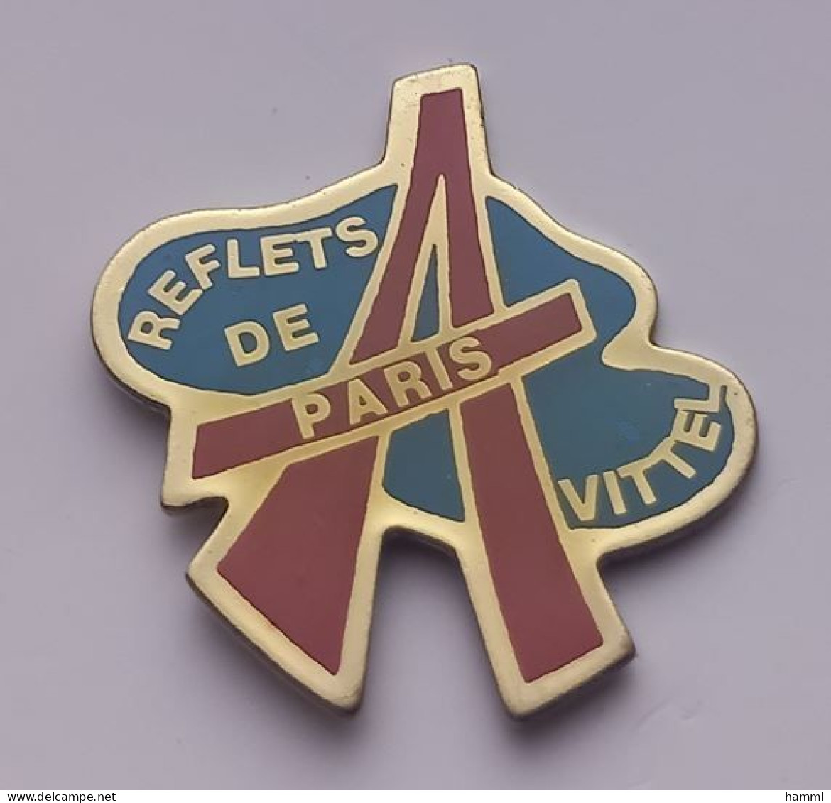 VF03 Pin's Magasin Mode Reflets De Paris Avec Tour Eiffel à VITTEL VOSGES Achat Immédiat - Città