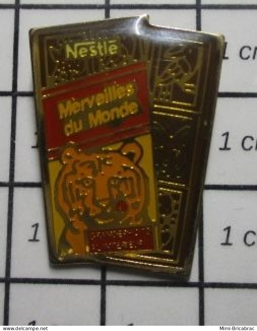 710A Pin's Pins / Beau Et Rare / ALIMENTATION / CHOCOLAT NESTLE MERVEILLES DU MONDE TIGRE - Alimentación