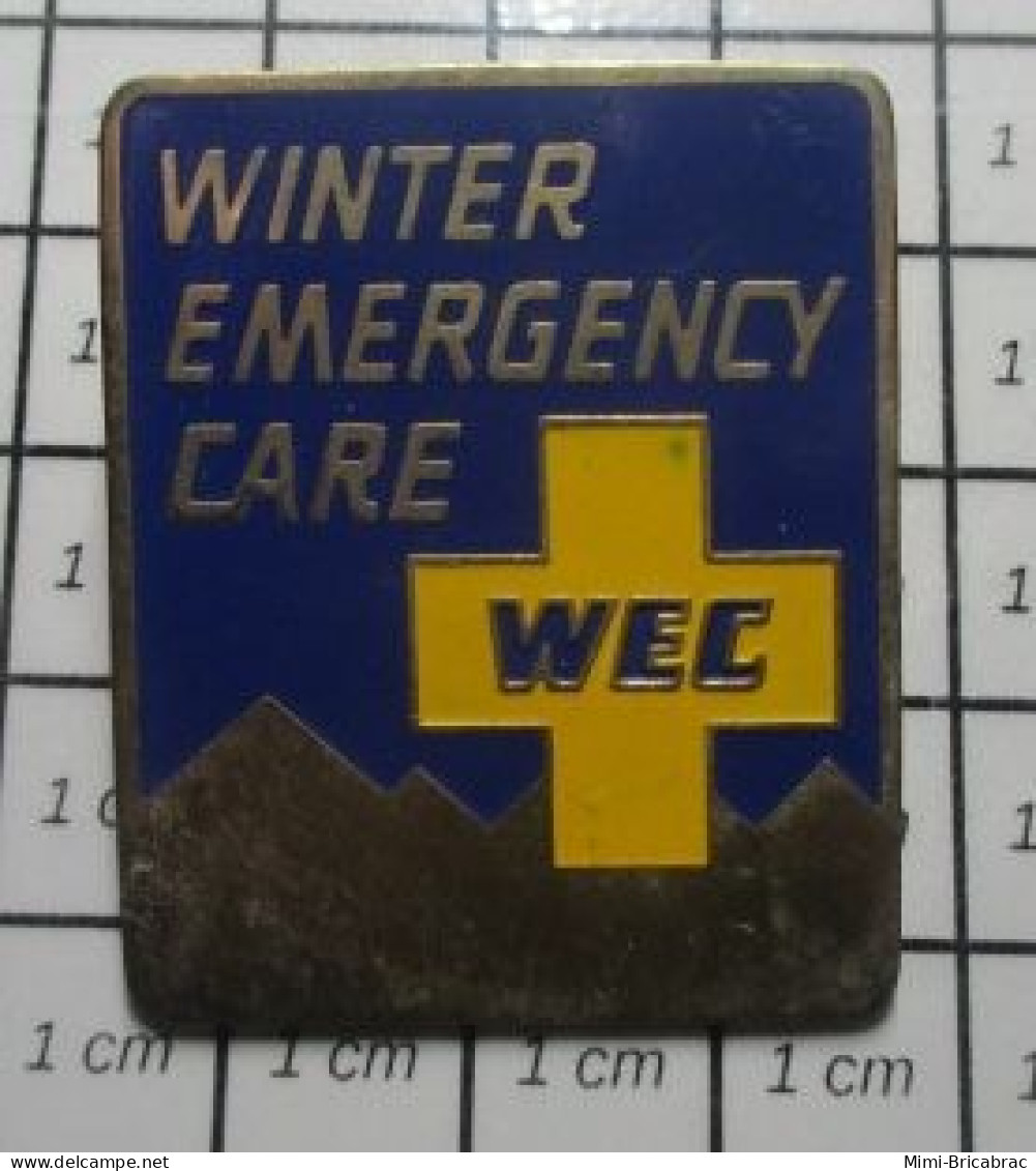 811A Pin's Pins / Beau Et Rare / ASSOCIATIONS / WEC WINTER EMERGENCY CARE Grand Pin's Double Attache - Vereinswesen