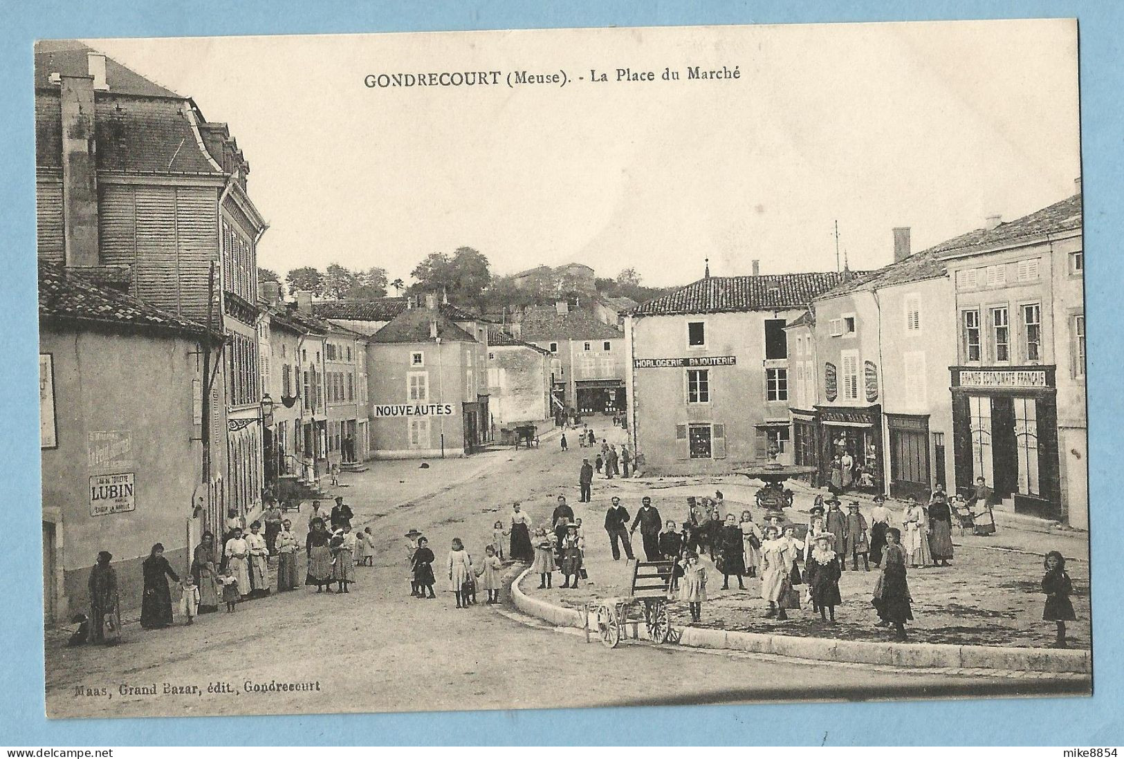 DA067  CPA  GONDRECOURT  (Meuse)  La Place Du Marché - HORLOGERIE BIJOUTERIE  -  GRANDS ECONOMATS FRANCAIS - ...  Animée - Gondrecourt Le Chateau