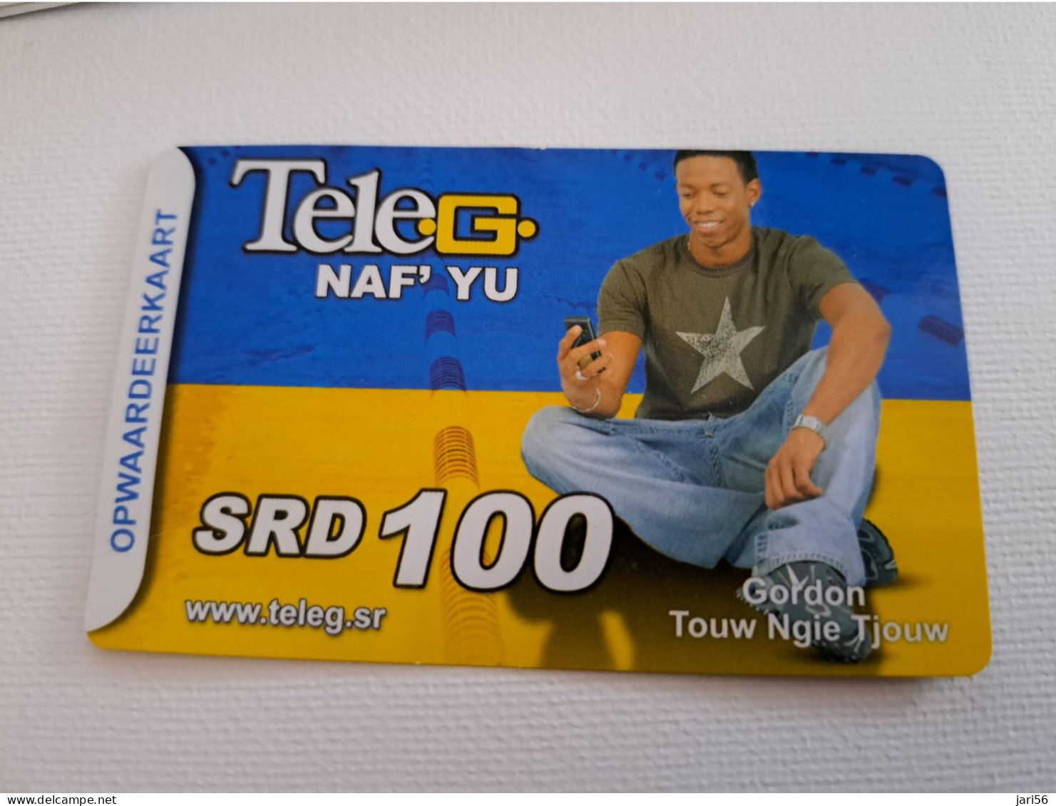 SURINAME US $100  / UNITS GSM  PREPAID /GORDON TOUW NGIE TJOUW / HIGH VALUE !!     MOBILE CARD           **16587 ** - Surinam