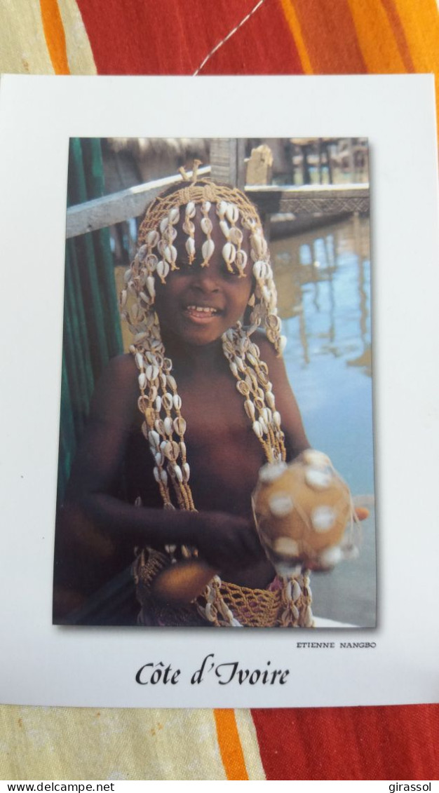 CPM COTE D IVOIRE JEUNE GARCON NOIR COQUILLAGE COQUILLAGES INITIATION DES ENFANTS IMAGES DE CHEZ NOUS  PHOTO E NANGBO - Costa De Marfil