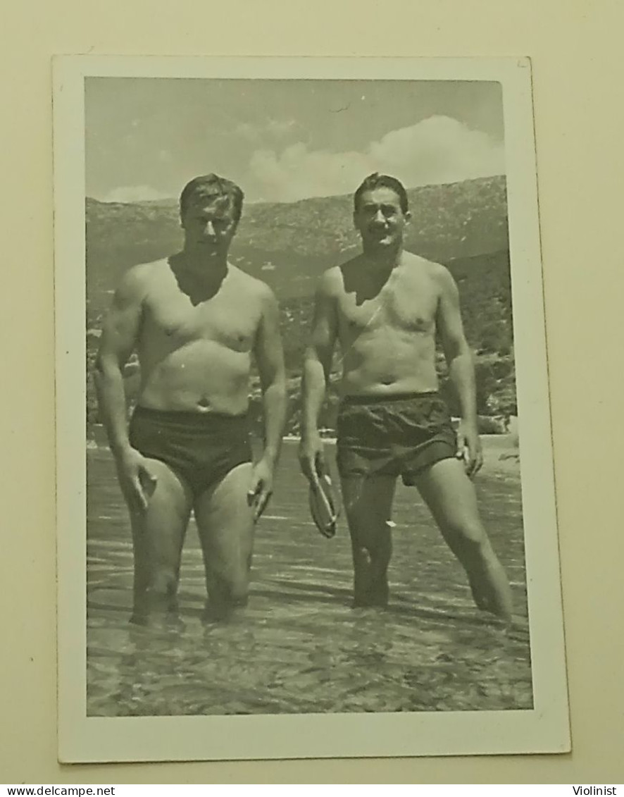 Two Naked Men In Swimming Trunks In The Sea - Personnes Anonymes