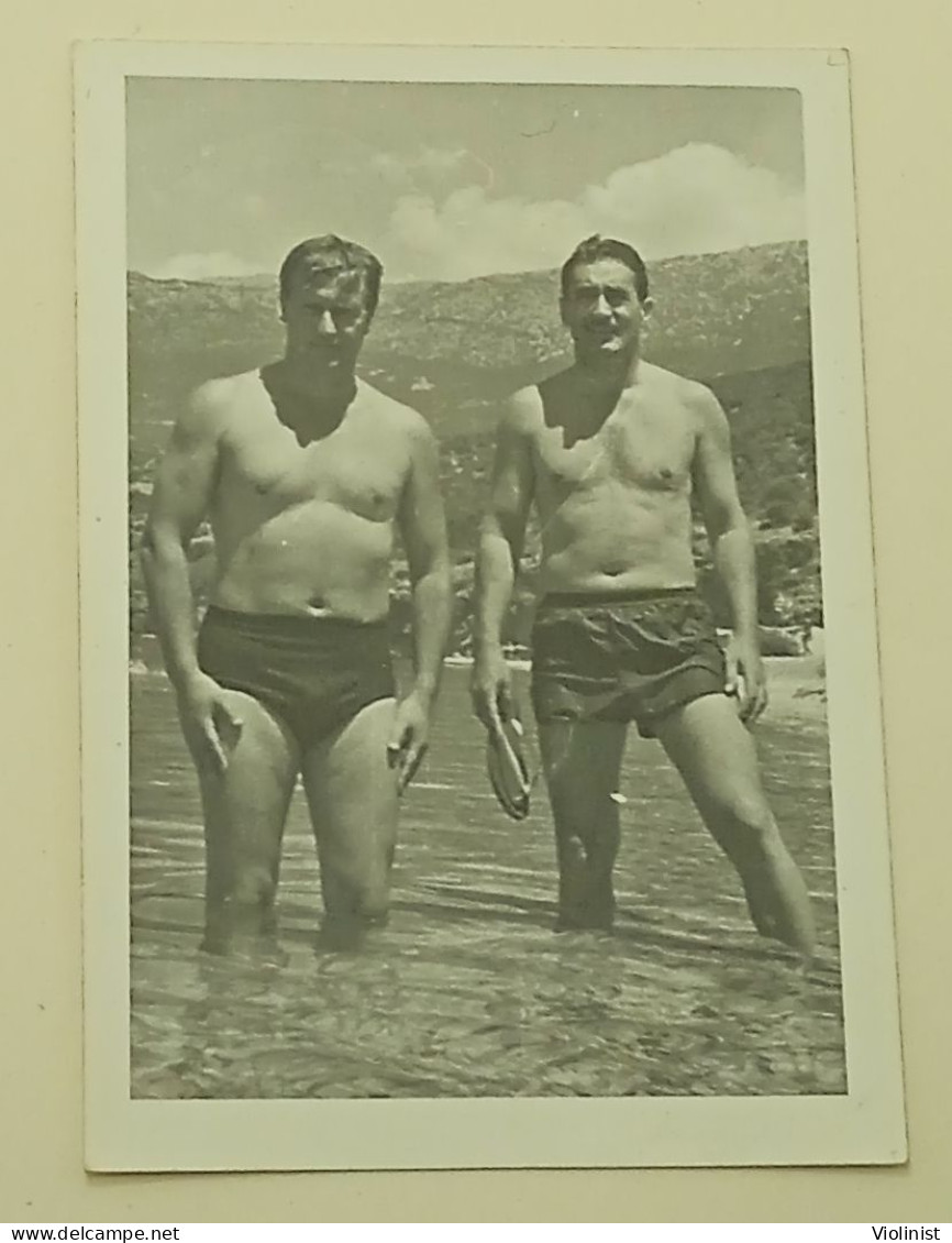 Two Naked Men In Swimming Trunks In The Sea - Personnes Anonymes