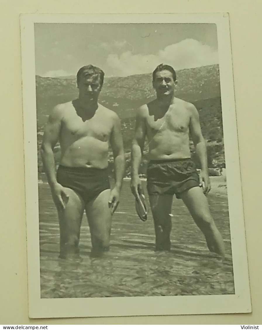 Two Naked Men In Swimming Trunks In The Sea - Personnes Anonymes