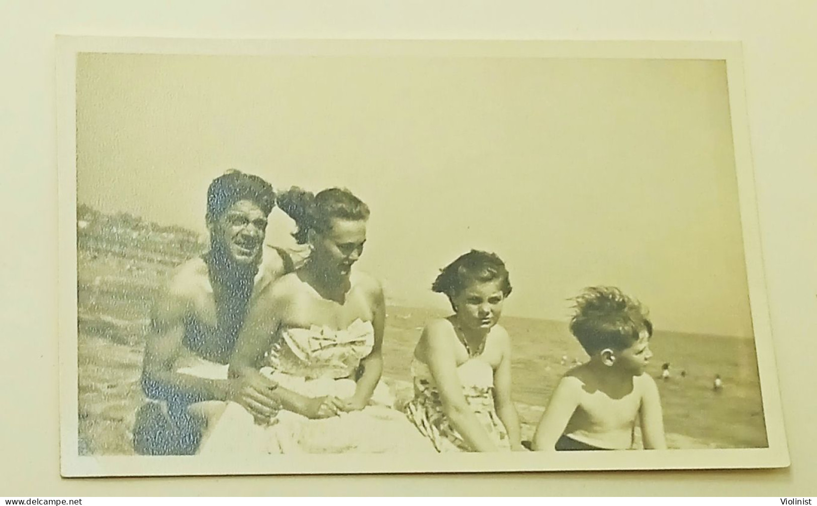 Boy, Young Girl, Woman And Man On The Beach In Windy Weather - Personnes Anonymes