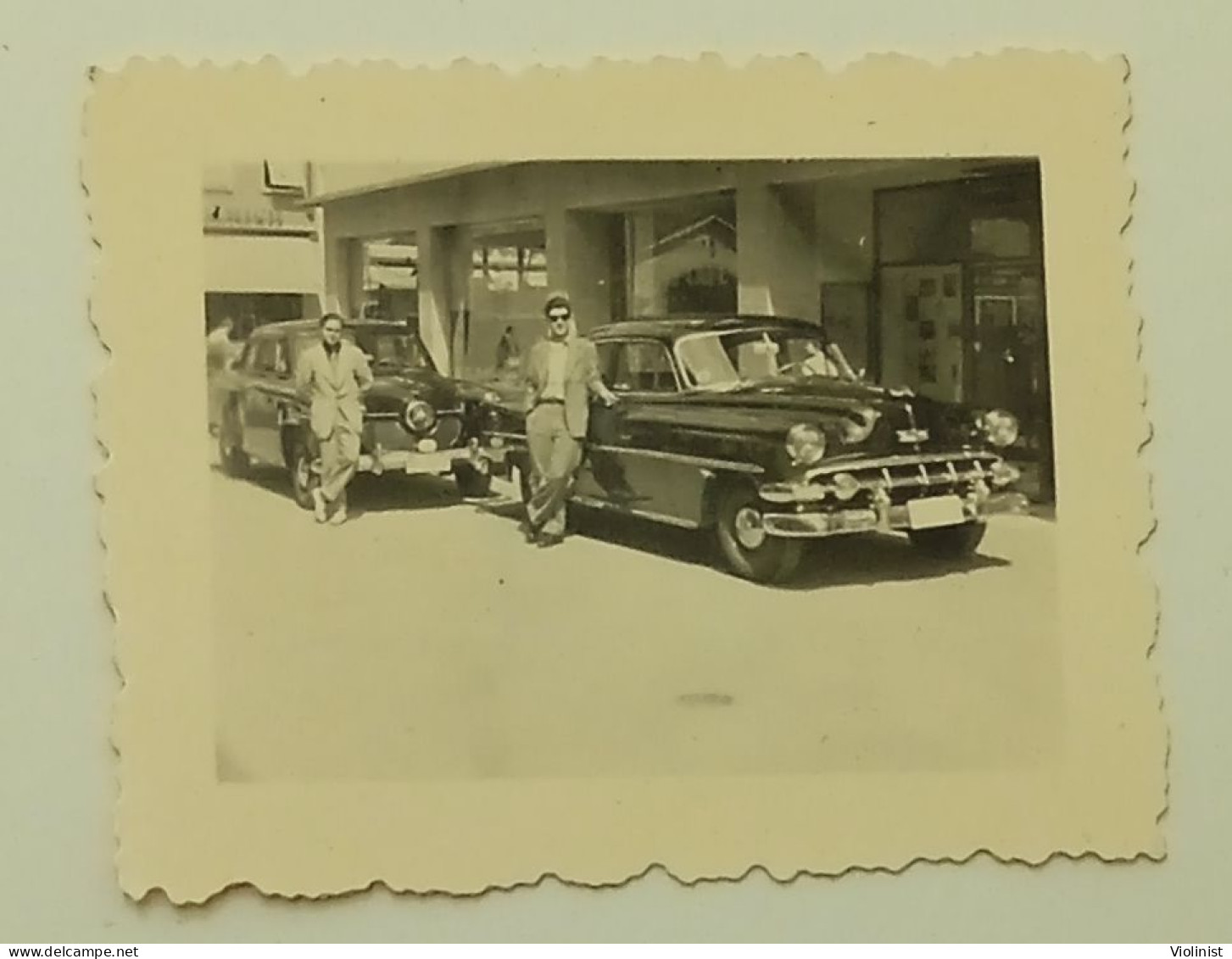 People On The Street At Studebaker Commander And Chevrolet Bel Air Cars - Cars