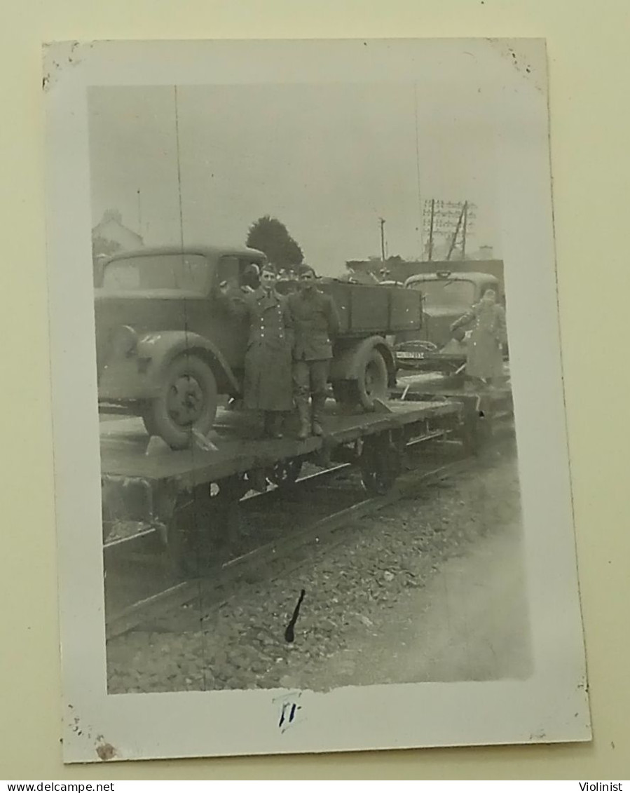 Soldiers Near Trucks Loaded Onto Train Carriages - Automobiles