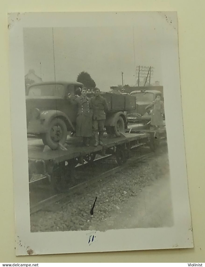 Soldiers Near Trucks Loaded Onto Train Carriages - Automobiles