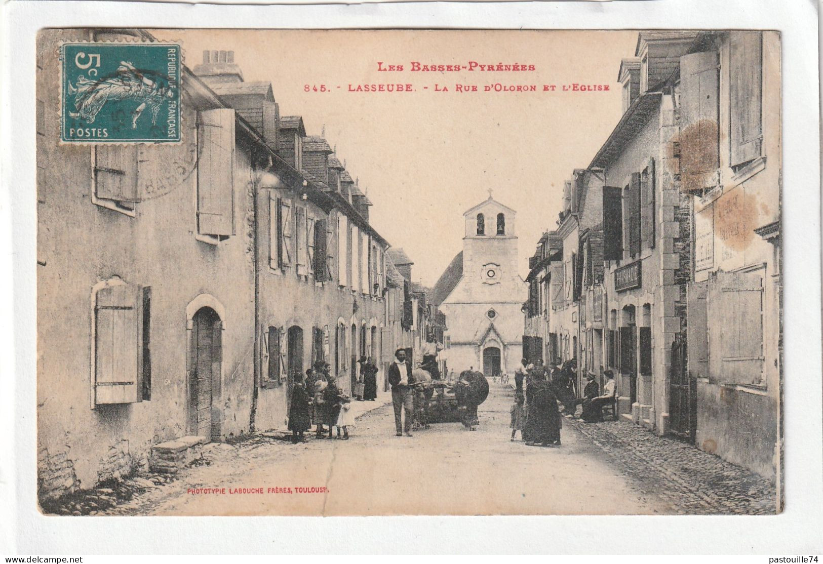 CPA :  14 X 9  -  LASSEUBE  -  La   Rue  D'Oloron  Et  L'Eglise - Lasseube