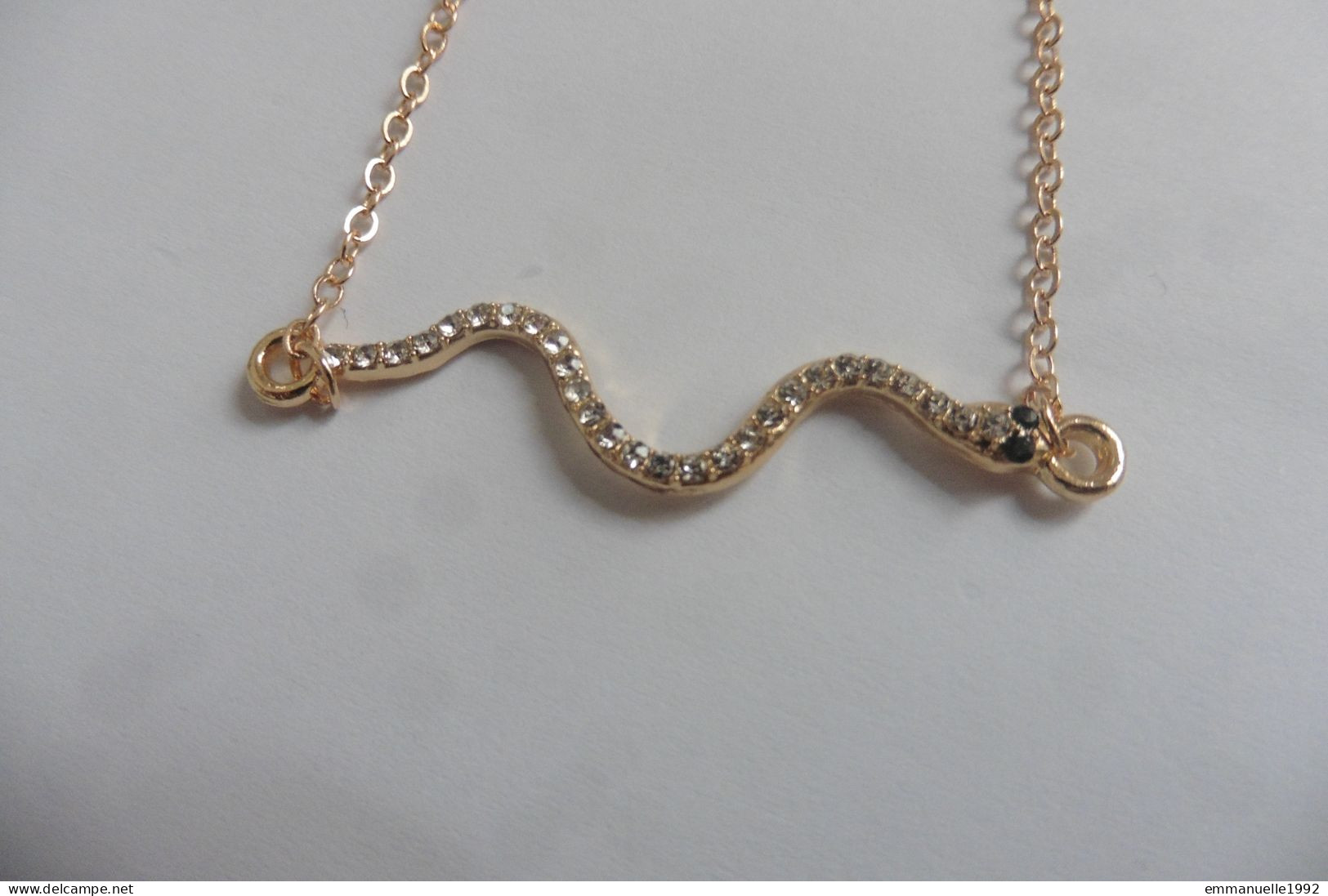 Neuf - Bracelet réglable chaine métal doré serpent serti strass yeux couleur émeraude