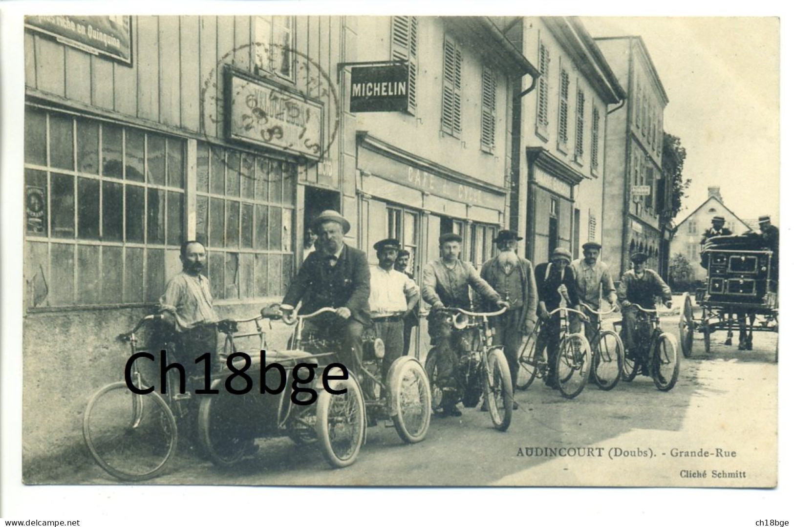 CPA 25 Doubs - AUDINCOURT Grande Rue, Café Du Cyle, Marchand De Vélos - Superbe Animation, Quadricycle, Plaque Michelin - Montbéliard