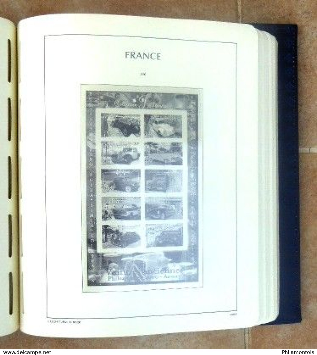 Album LEUCHTTURM + étui + intérieur FRANCE 1996/2003 sans charnière - 95 pages environ - Très bon état.