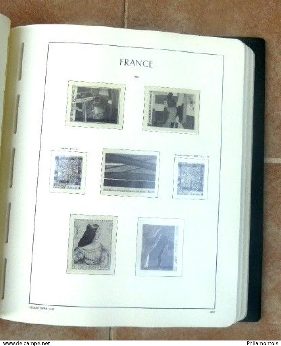 Album LEUCHTTURM + intérieur FRANCE 1980/1994 sans charnière - 110 pages environ - Bon état.