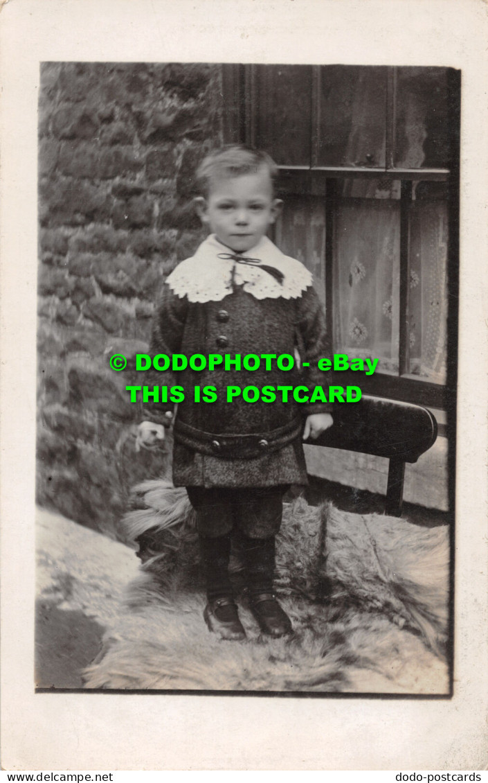 R477807 A Little Boy Is Standing On A Chair. 1913 - World