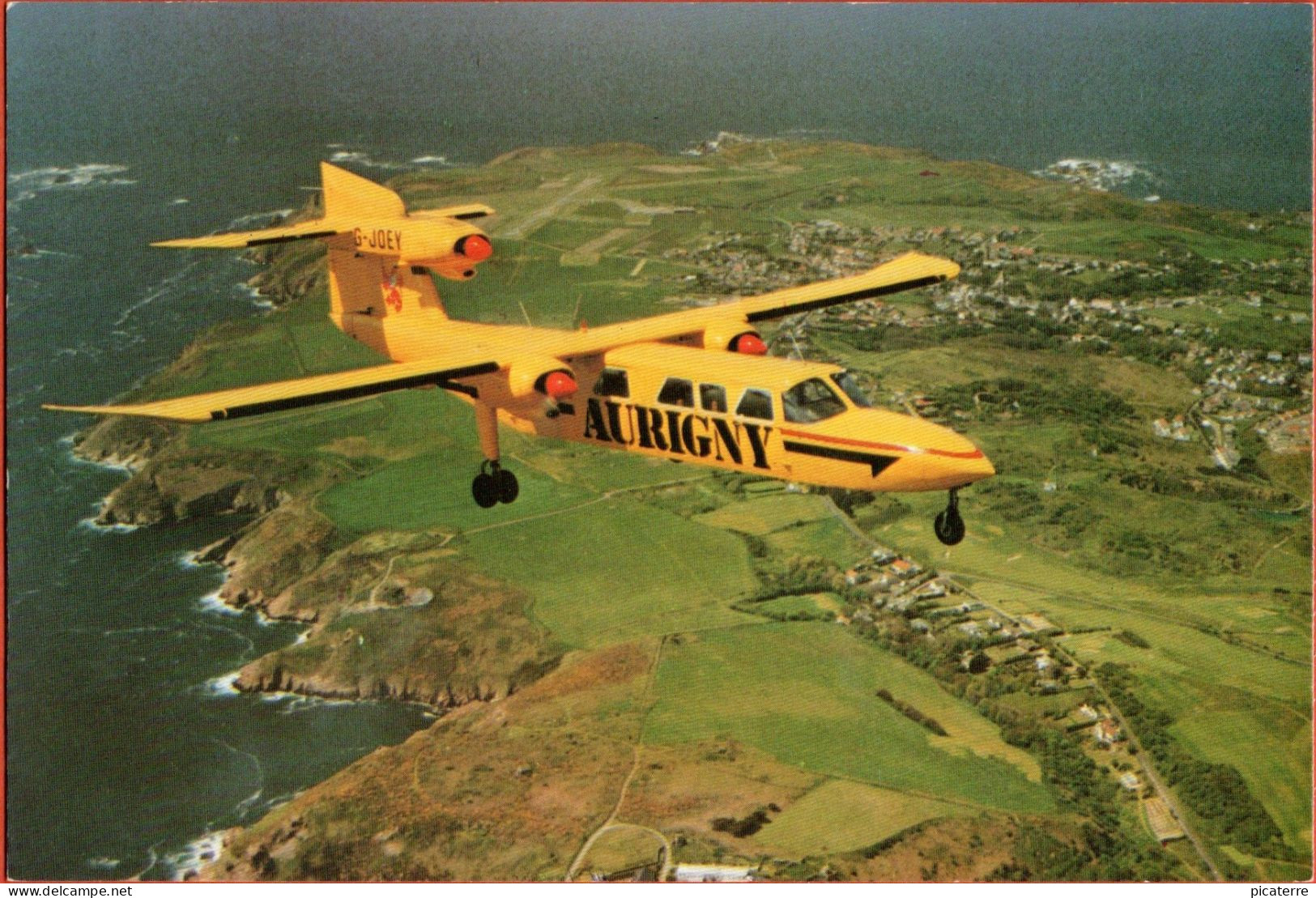 G-JOEY -  One Of Aurigny's Nine BN Trislander Aircraft Flying Over Alderney, Channel Islands C1980 -Ile Aurigny - Alderney