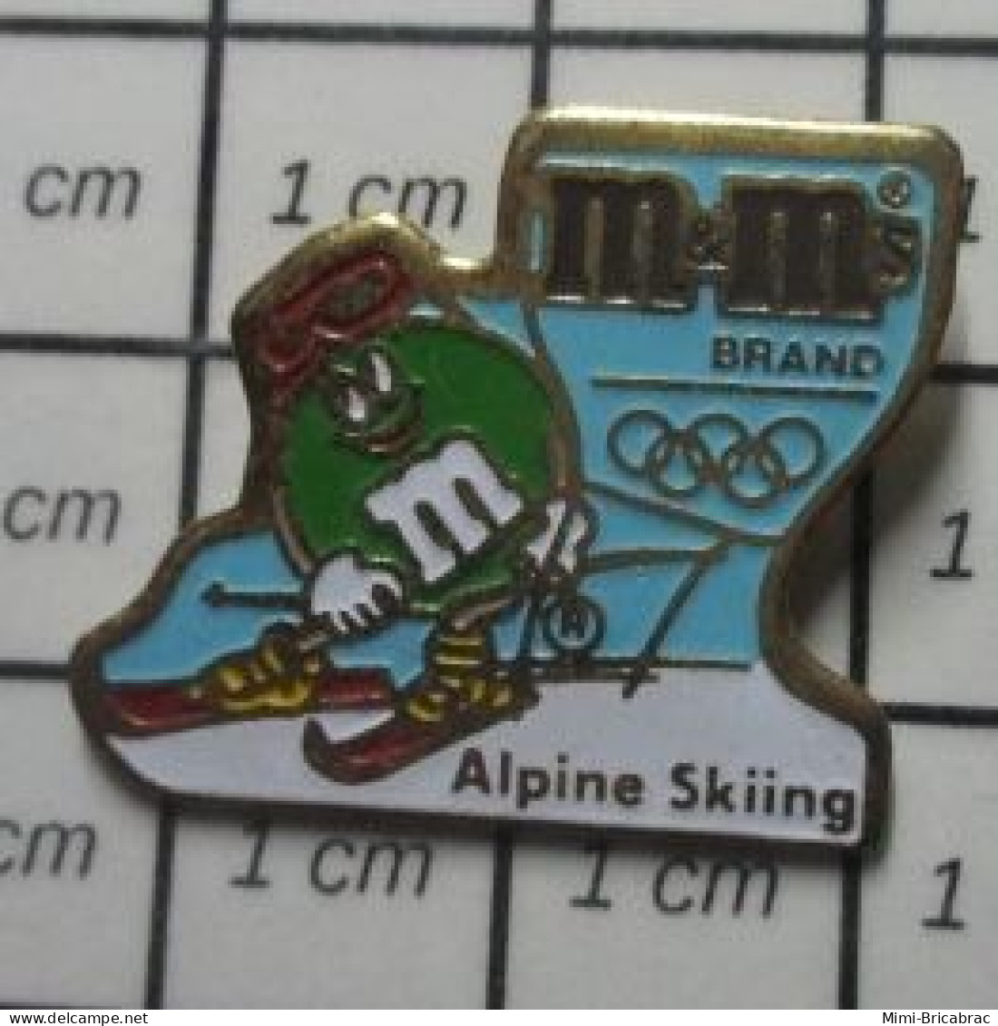 917 Pin's Pins / Beau Et Rare / JEUX OLYMPIQUES / SKI ALPIN ALPINE SKIING M&M'S BRAND SMARTIES Oui ! - Jeux Olympiques