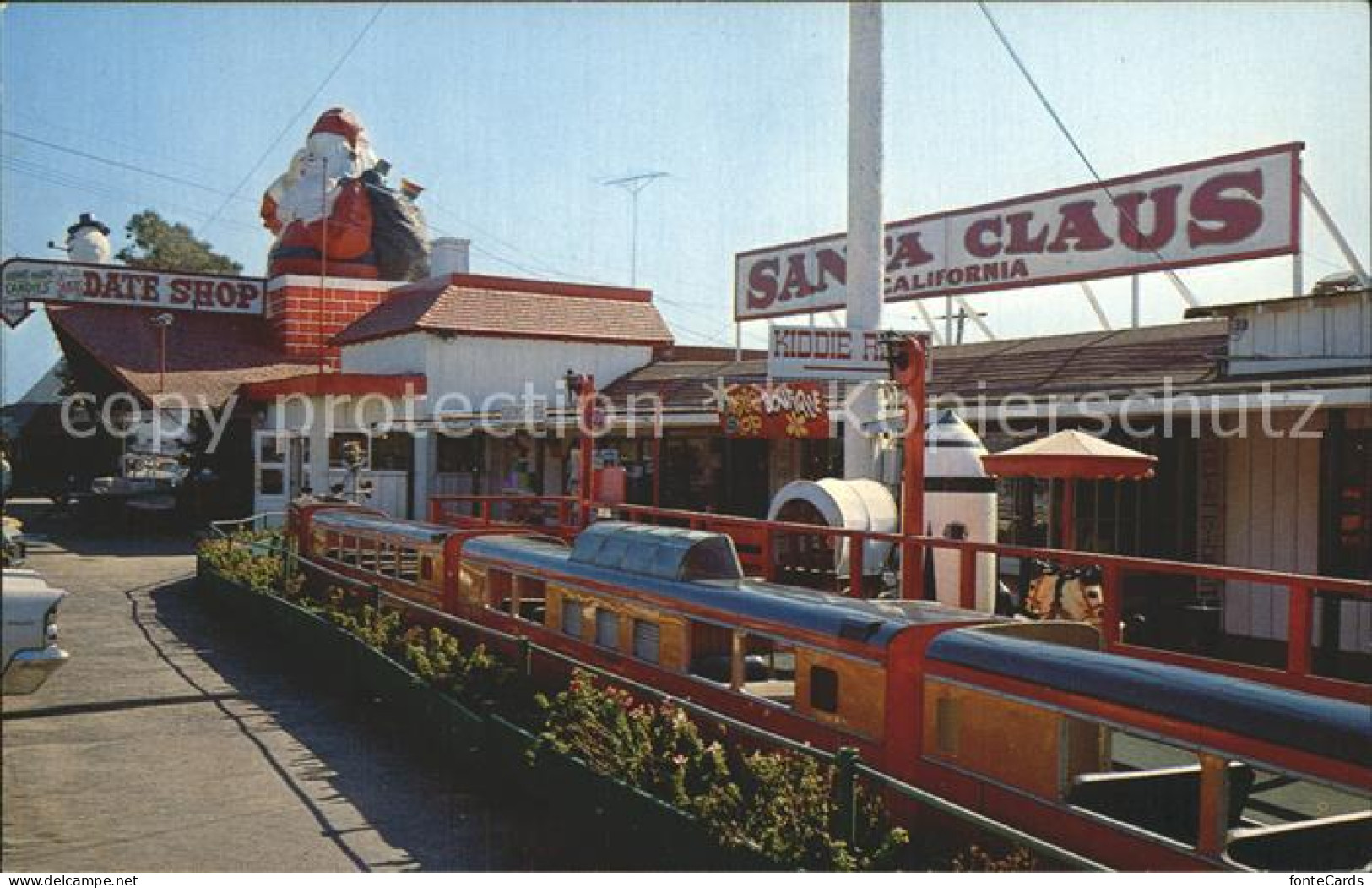 72253220 California_City Fun Train Big Santa And Giant Snowman In Background - Autres & Non Classés