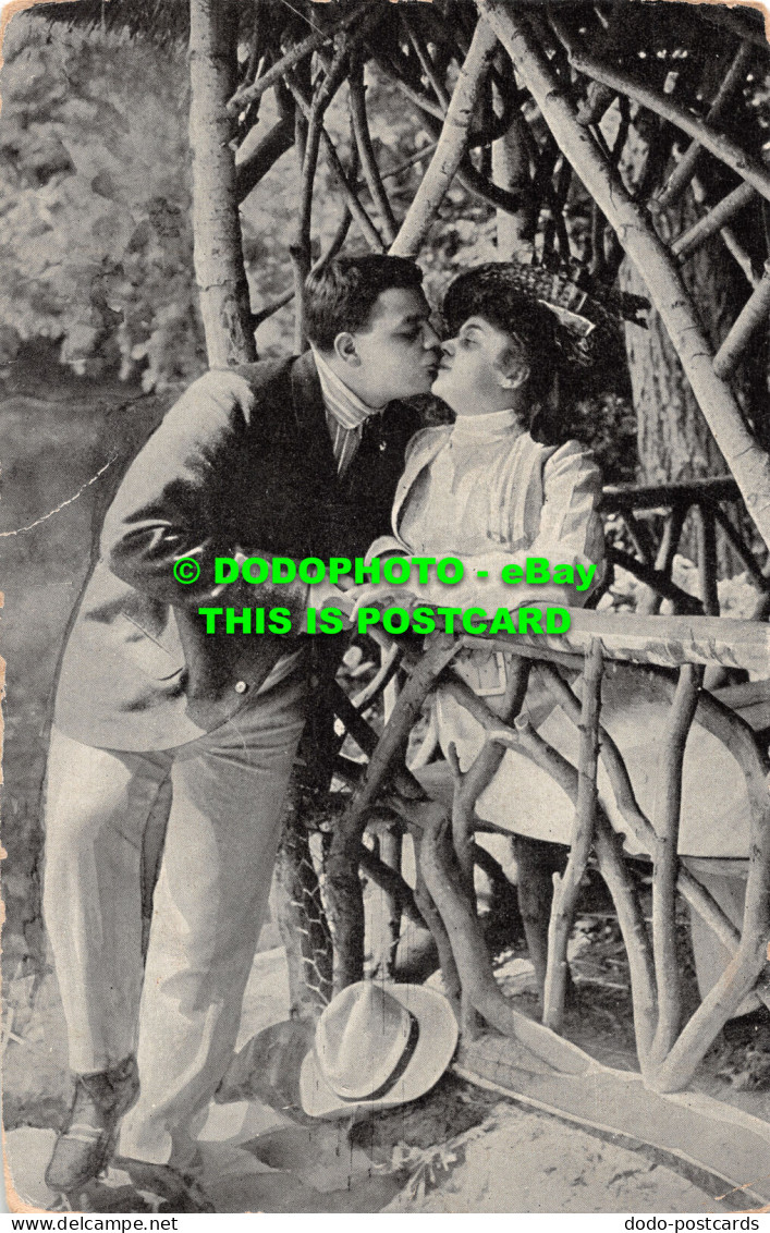 R516176 A Man Kisses A Woman. Postcard - World