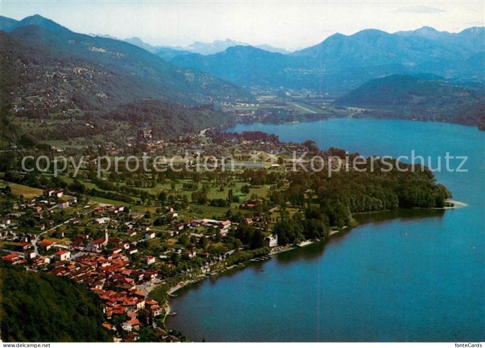 13246534 Caslano Luganersee Alpenpanorama Fliegeraufnahme Caslano - Autres & Non Classés