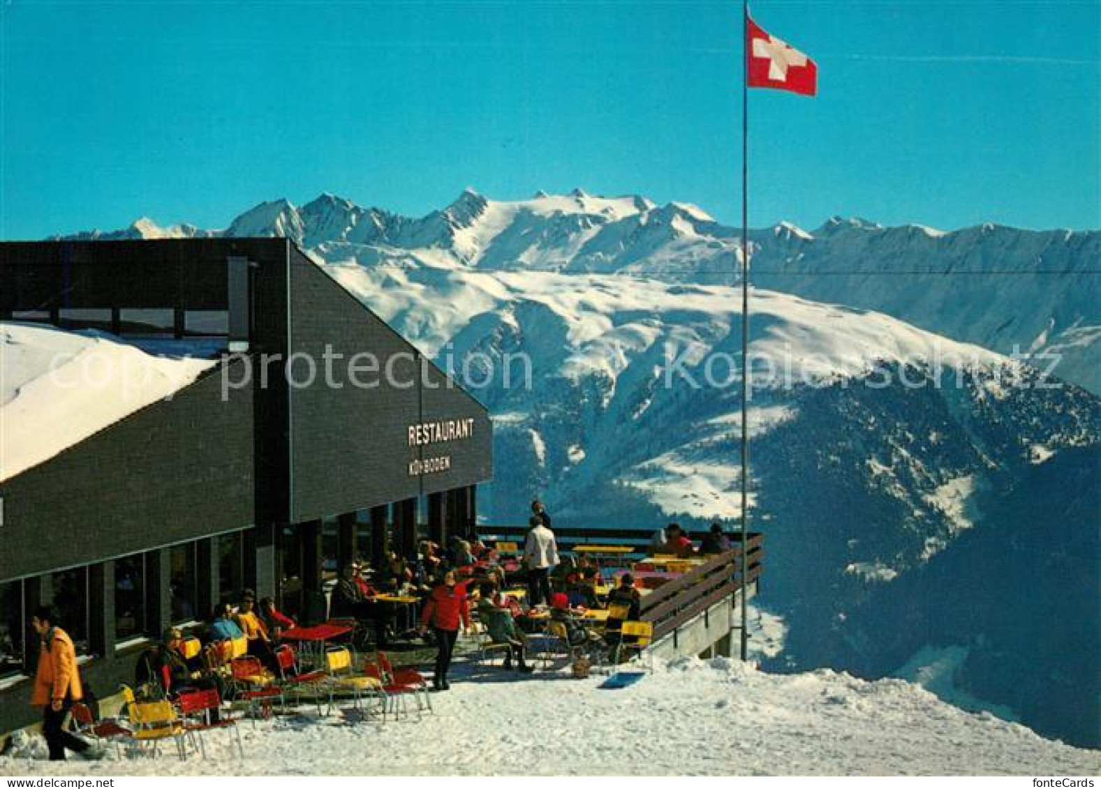 13161163 Fiesch Bergrestaurant Kuehboden Sonnenterrasse Schweizer Flagge Gebirgs - Autres & Non Classés