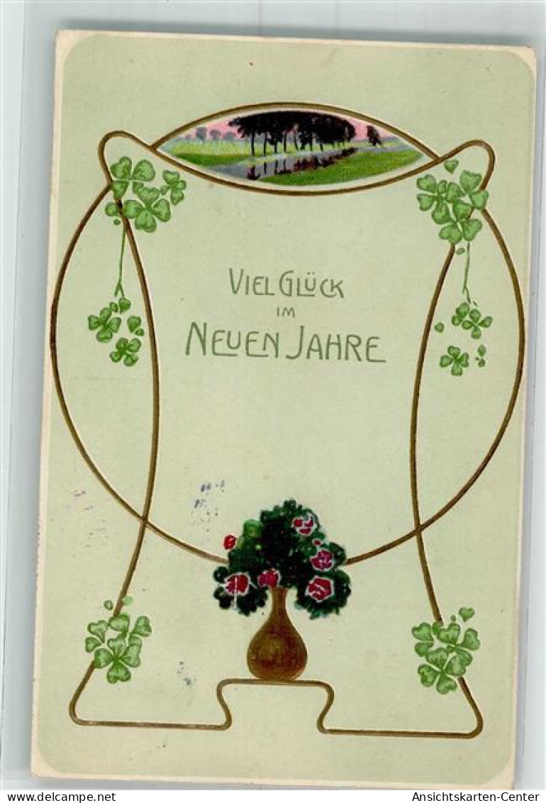 39801805 - Kleeblaetter Blumen In Vase - New Year