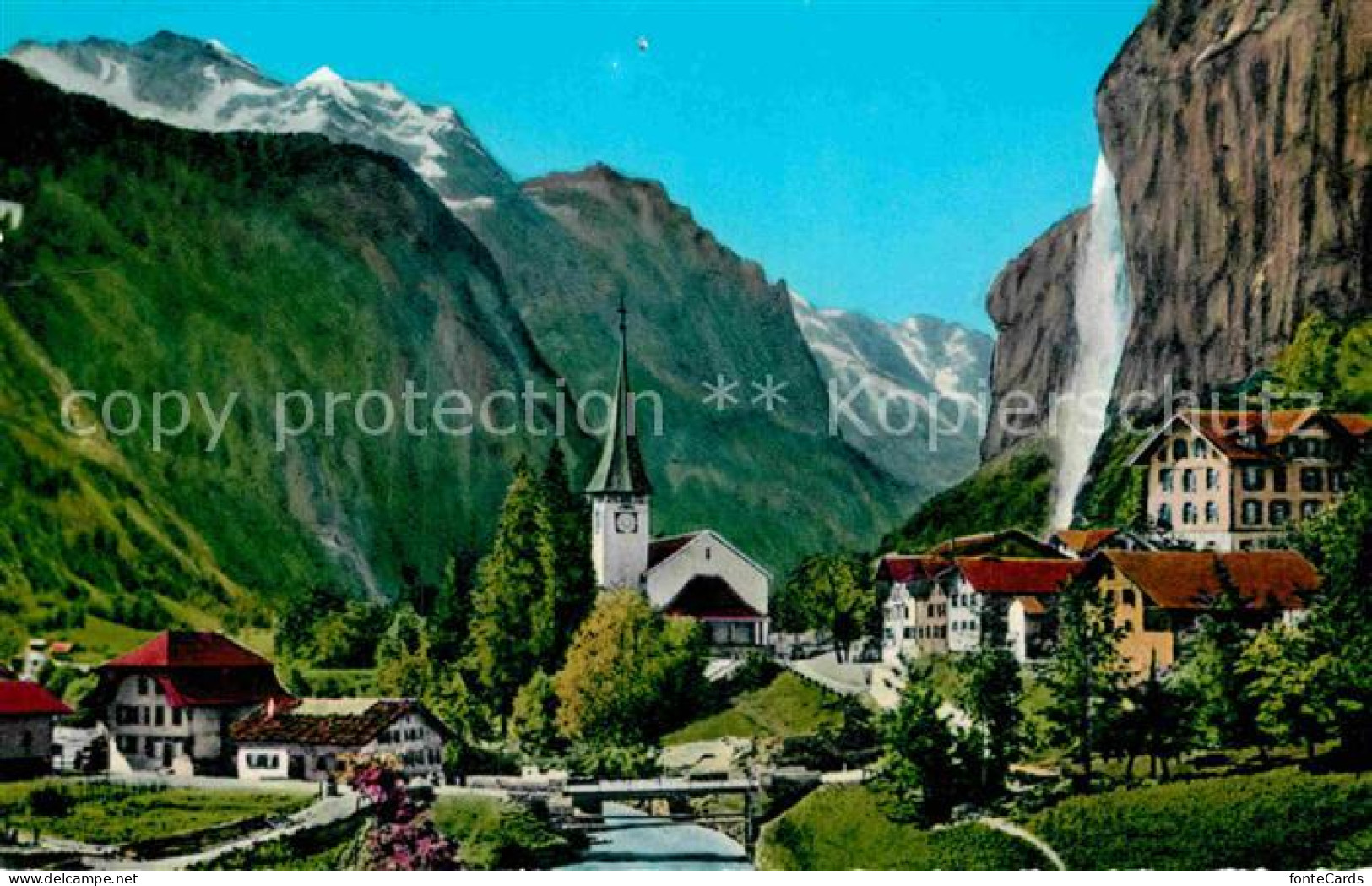 12858241 Lauterbrunnen BE Ortsansicht Mit Kirche Staubbach Wasserfall Jungfrau B - Altri & Non Classificati