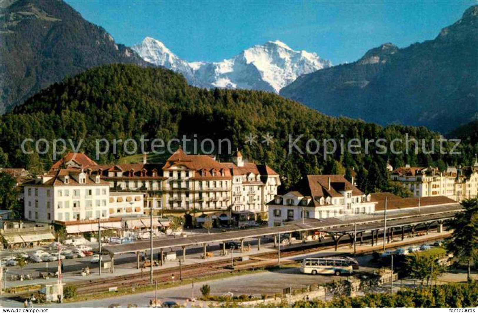 12744164 Interlaken BE Bahnhofplatz Mit M?nch Und Jungfrau Interlaken - Autres & Non Classés