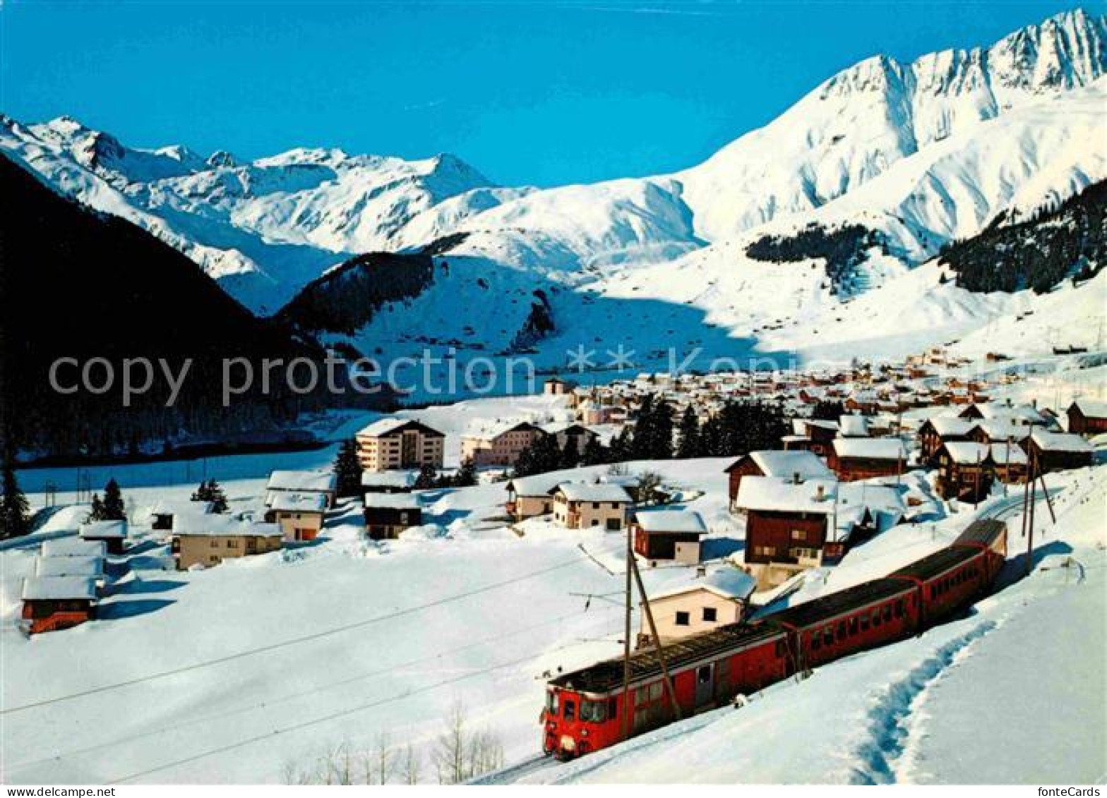 12719422 Bugnei Winterpanorama Gegen Piz Badus Und Skigebiet Von Milez Eisenbahn - Autres & Non Classés