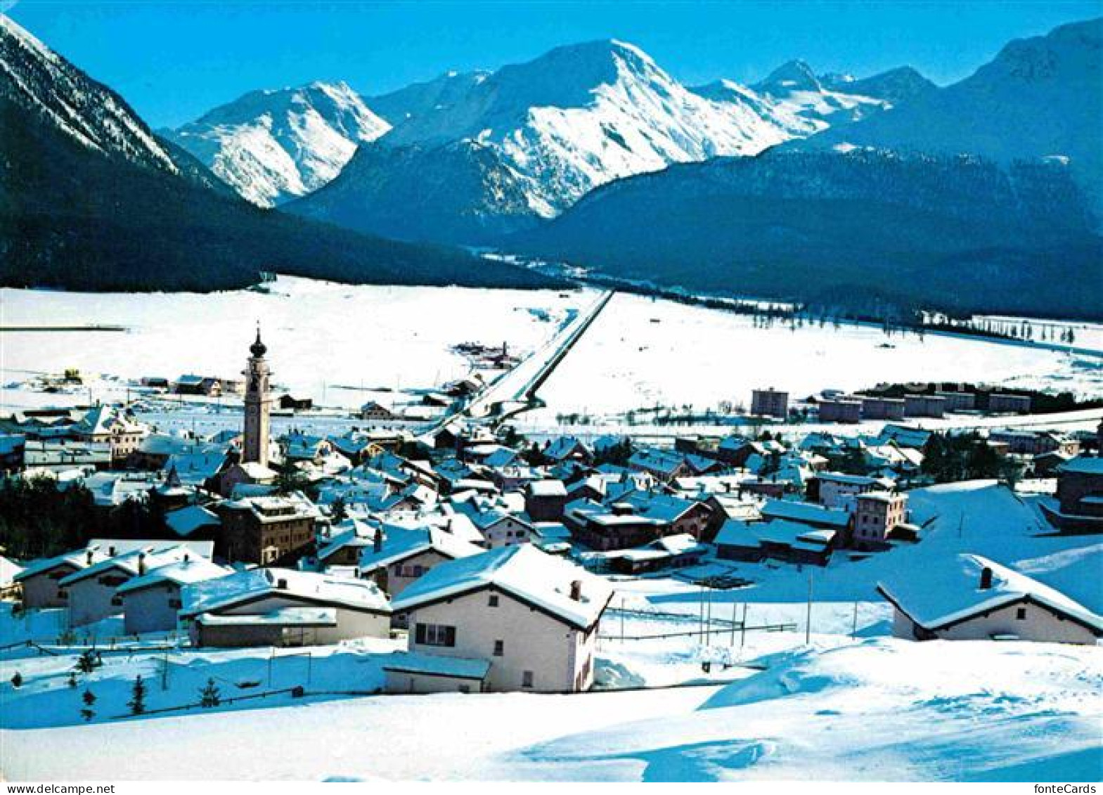 12647673 Samedan Gesamtansicht Mit Alpenpanorama Engadin Im Winter Samedan - Other & Unclassified