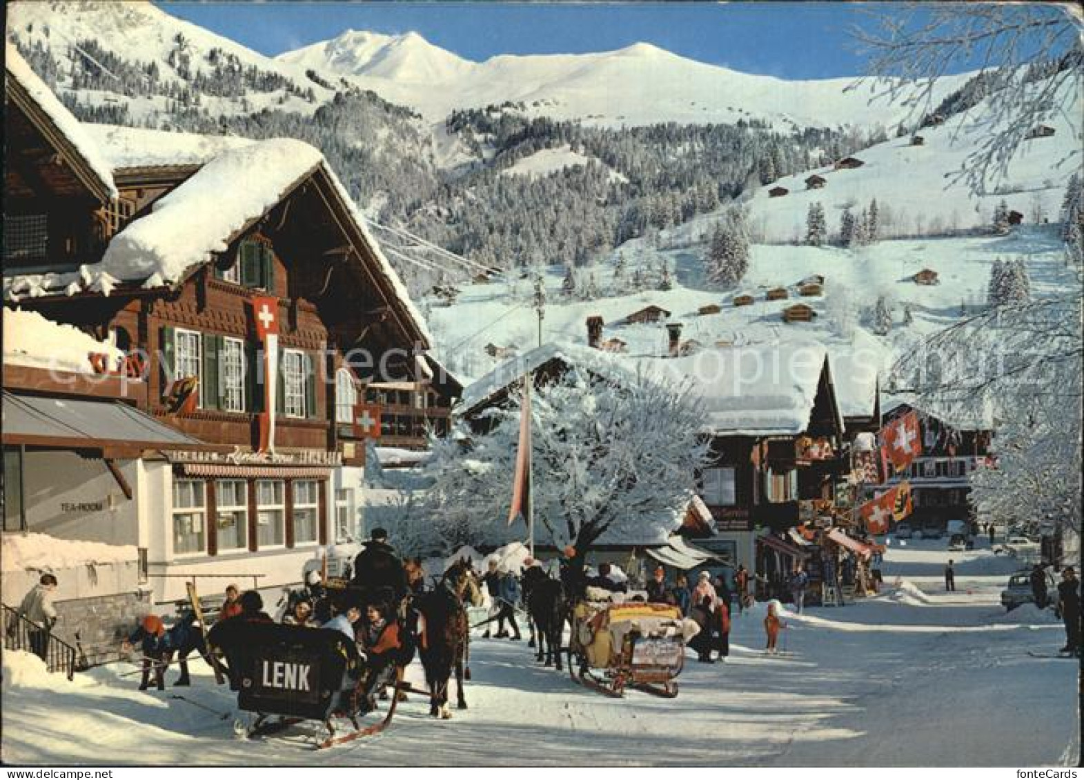 12483973 Lenk Simmental Dorfstrasse Pferdeschlitten Winterpanorama Berner Alpen  - Andere & Zonder Classificatie