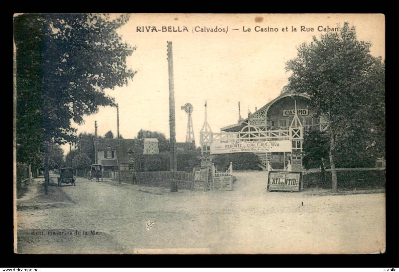 14 - OUISTREHAM - RIVA-BELLA - LE CASINO ET LA RUE CABAN - EOLIENNE - Ouistreham