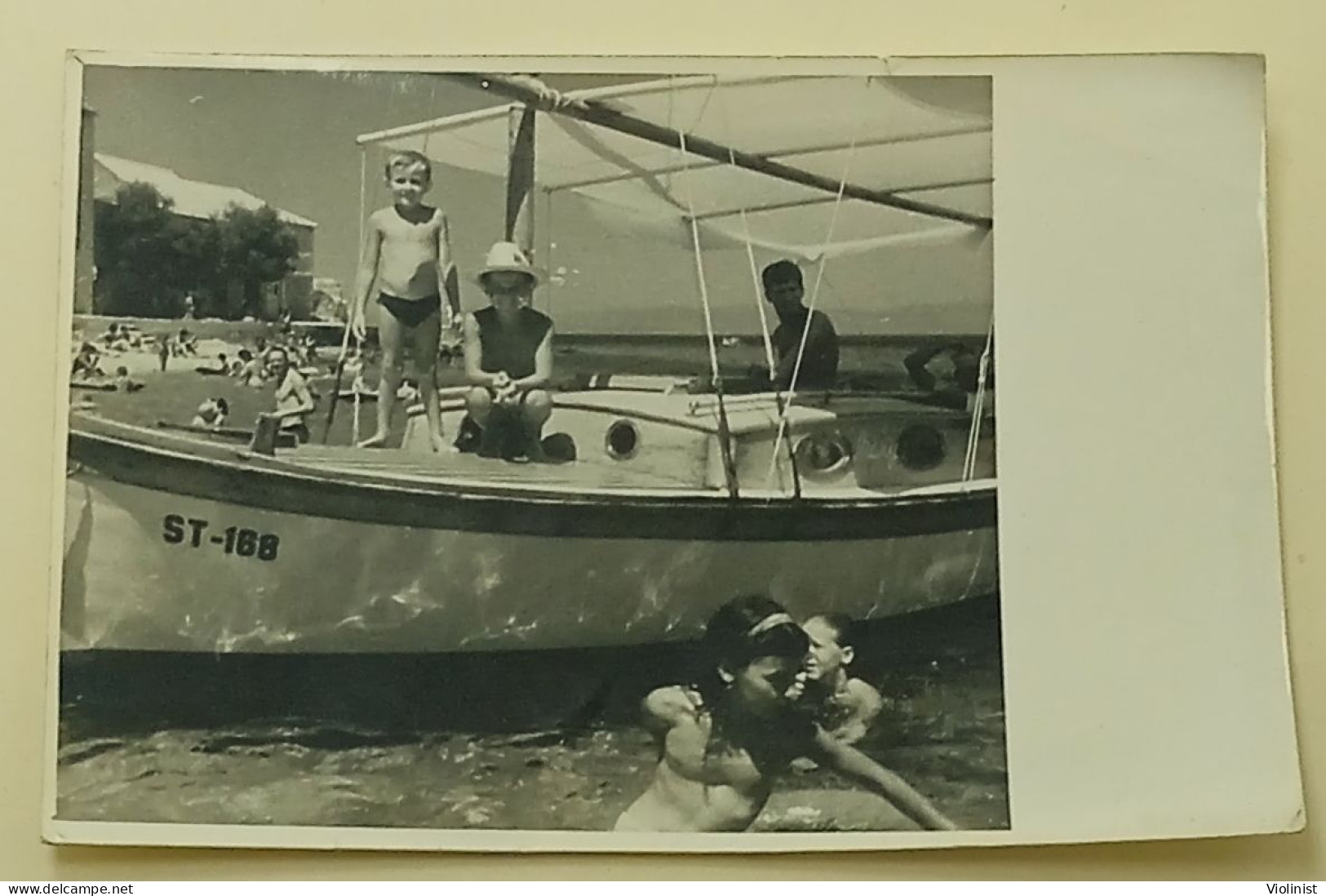 Two Boys On A Boat At Sea - Personnes Anonymes