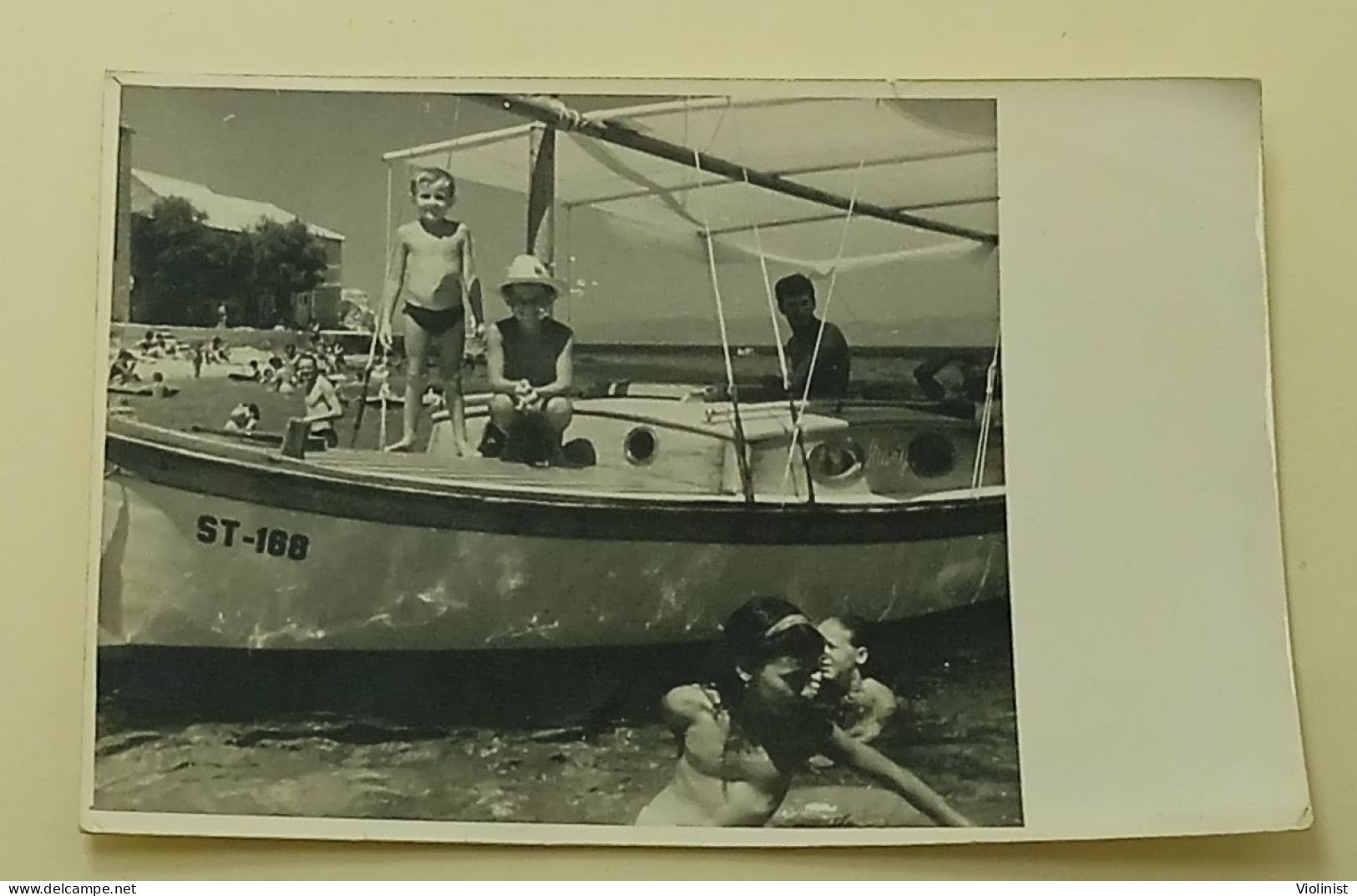 Two Boys On A Boat At Sea - Anonymous Persons