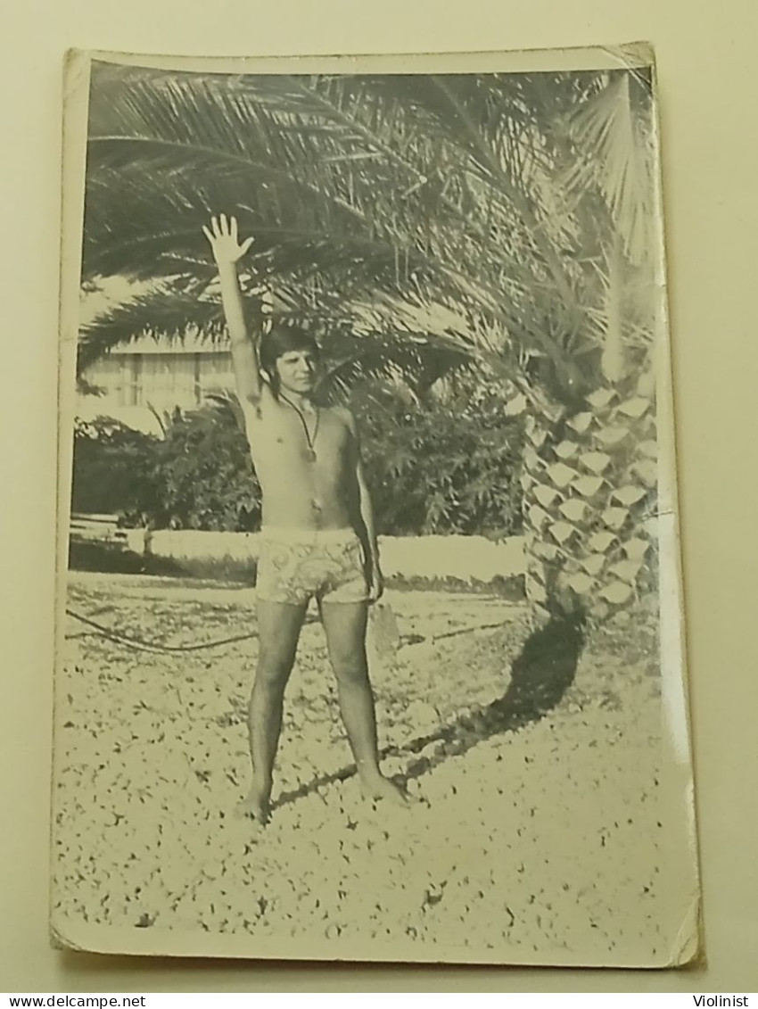 A Guy At Sea Under A Palm Tree - Anonymous Persons