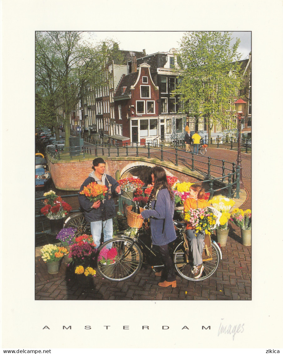 Netherlands > Noord-Holland > Amsterdam - Flower Seller - Cycling,bike,girl,bridge - Amsterdam