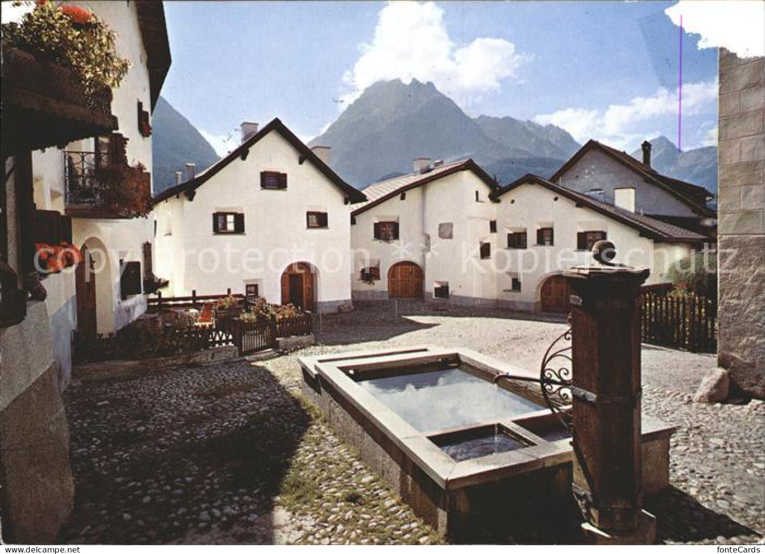 11896880 Scuol Tarasp Vulpera Dorfplatz Mit Brunnen In Scuol Scuol - Other & Unclassified