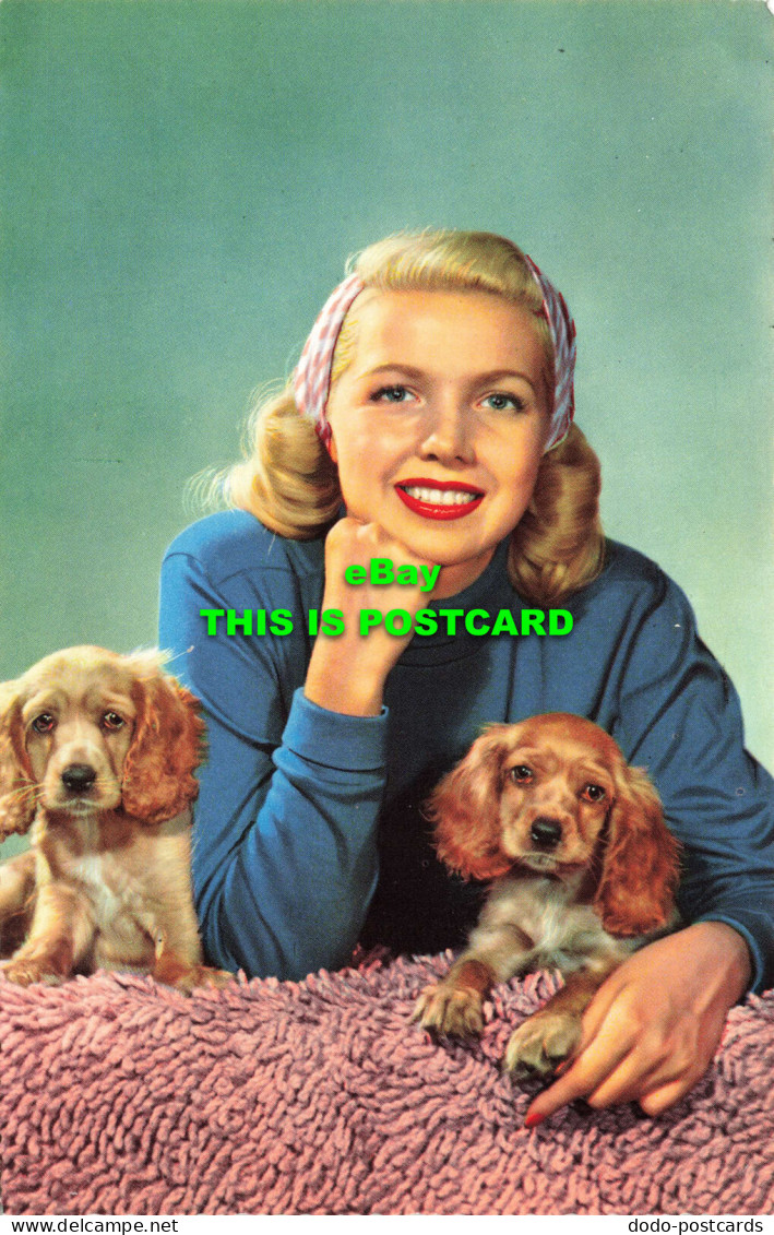 R574853 Woman And Puppies. 1941 10 - Monde