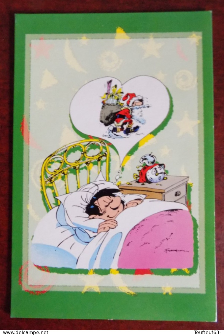 Cpm Gaston Lagaffe Franquin - Meilleurs Voeux - Rêvant Dans Son Lit D'être Le Père Noël - Postkaarten