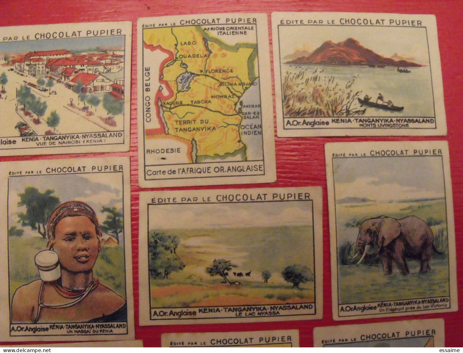 Lot 9 Images Chocolat Pupier. Album Afrique 1950. Kenya Tanganyka Nyassaland Livingstone Nairobi Massaï Ouganda - Andere & Zonder Classificatie