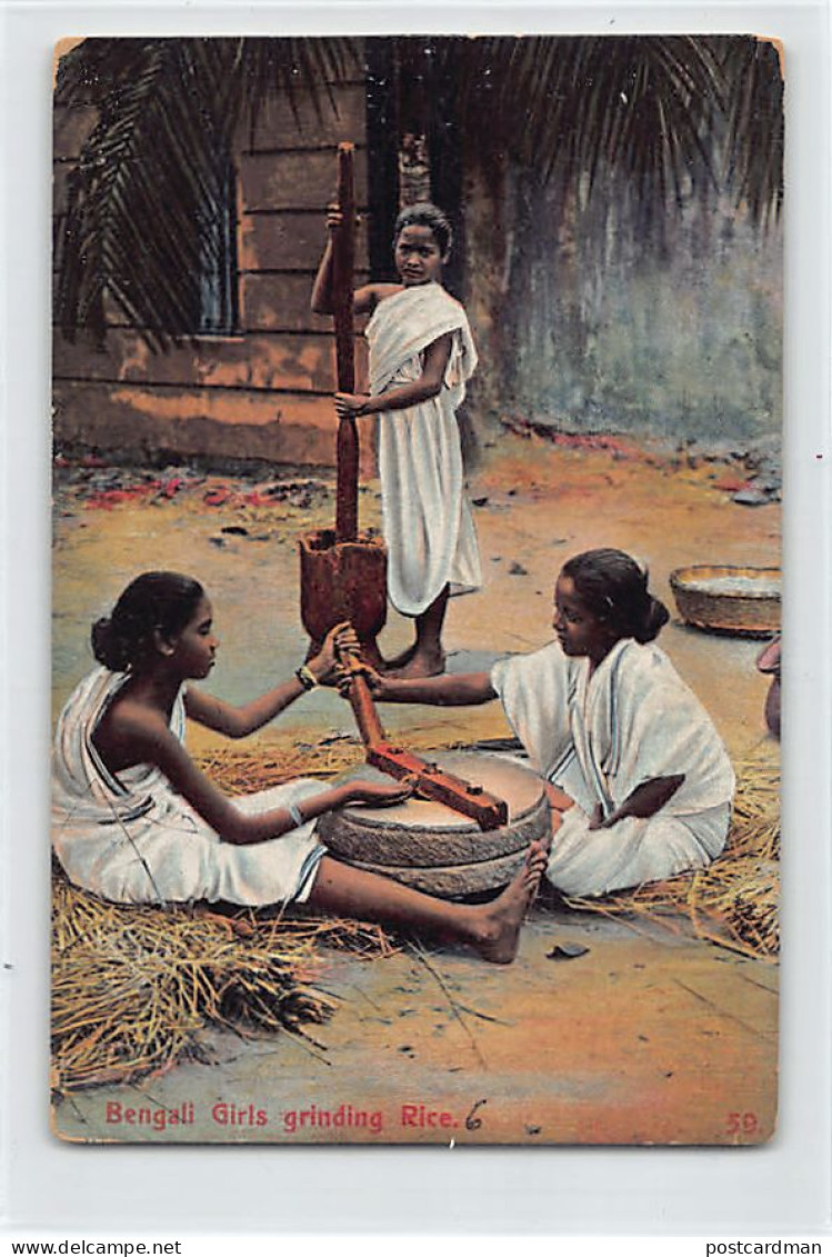 India - Bengali Girls Grinding Rice - India