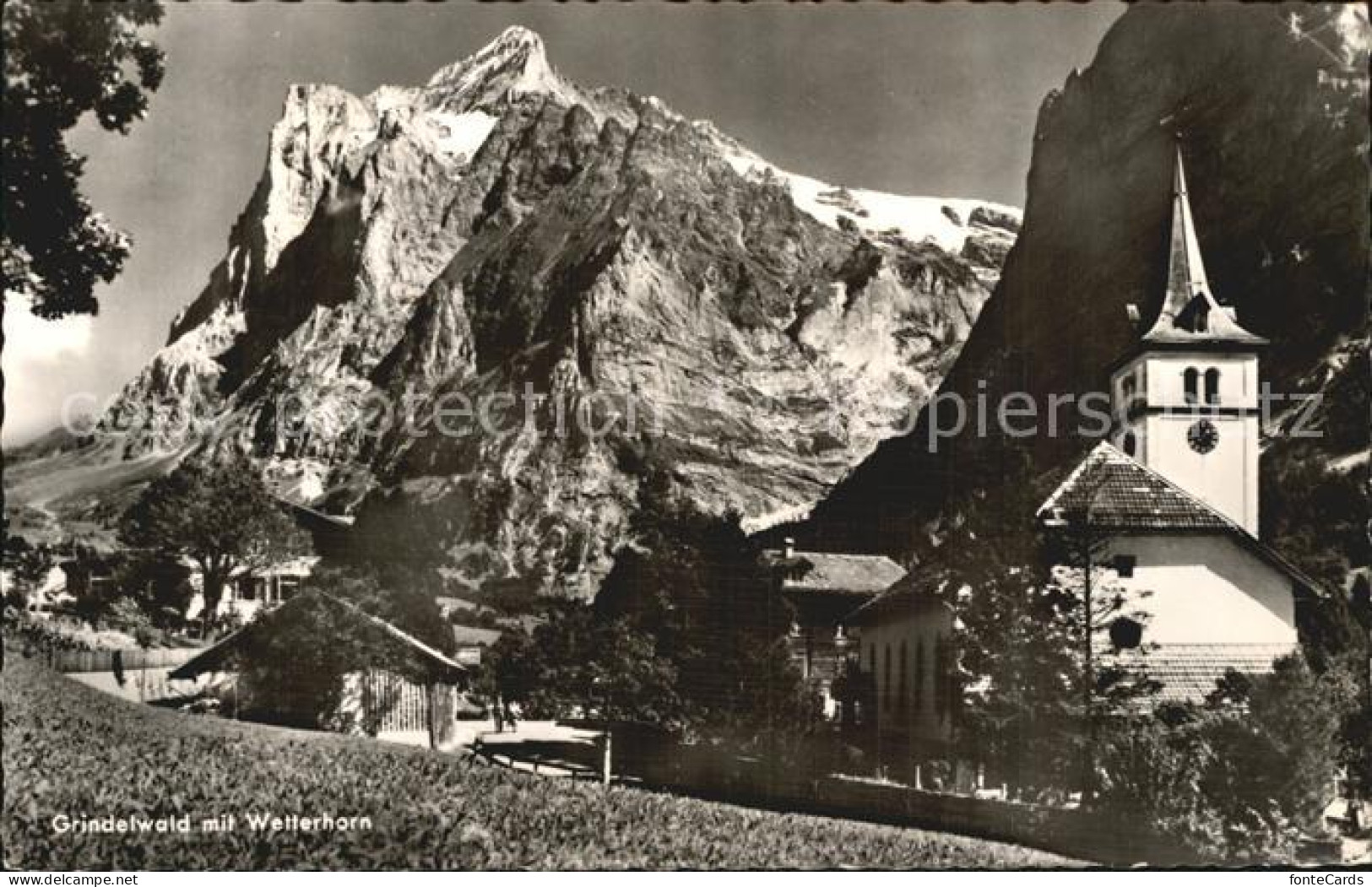 12453746 Grindelwald Ortsansicht Mit Kirche Wetterhorn Berner Alpen Grindelwald - Autres & Non Classés