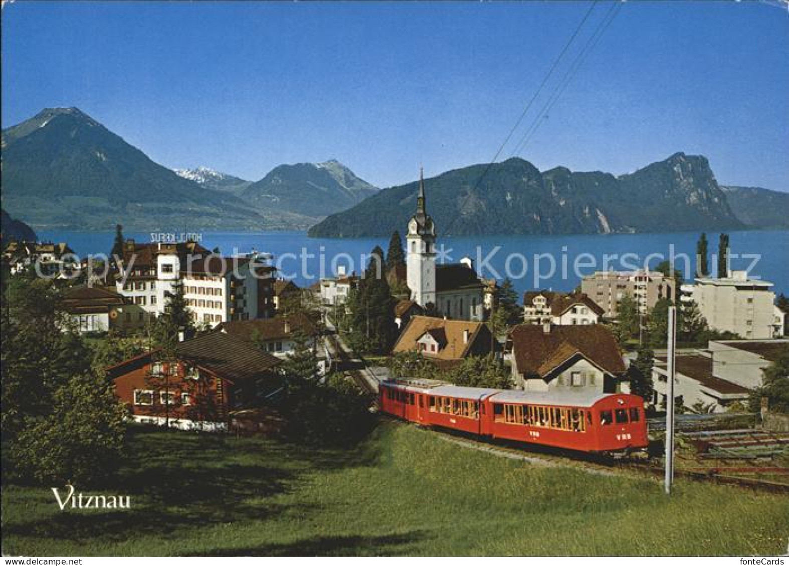 12053906 Vitznau Ortsansicht Mit Kirche Rigi Bahn Eisenbahn Buergenstock Stanser - Sonstige & Ohne Zuordnung