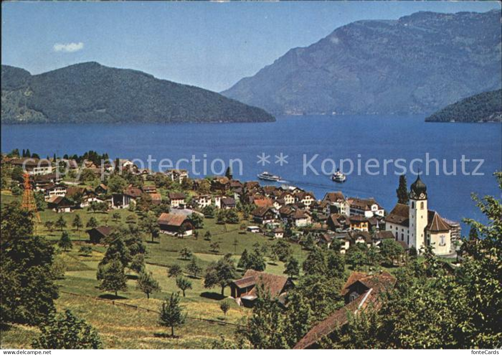 12048736 Beckenried Ortsansicht Mit Kirche Vierwaldstaettersee Alpen Beckenried - Altri & Non Classificati