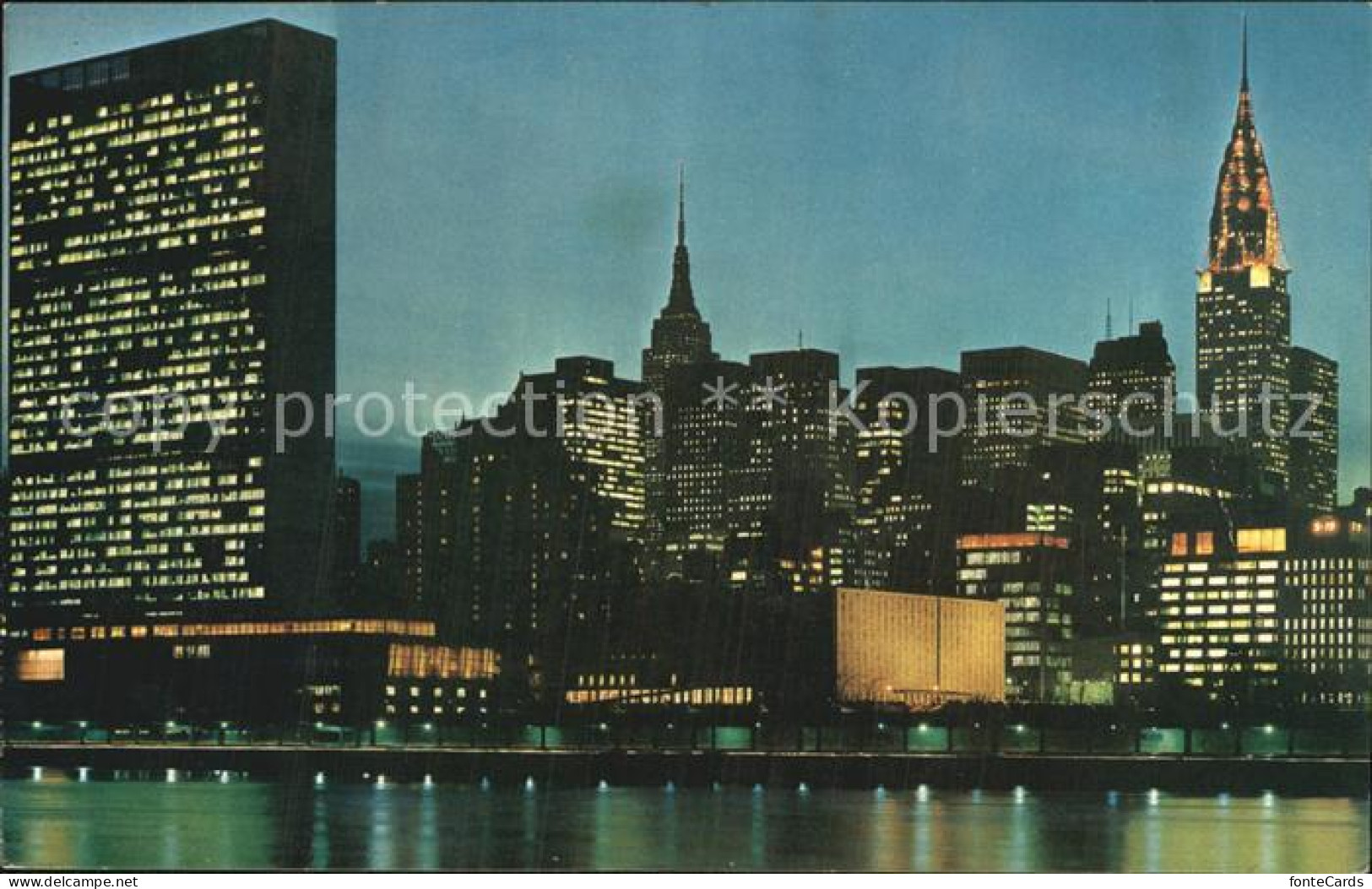 72497788 New_York_City United-Nations-Building Und Empire-State-Building At Nigh - Altri & Non Classificati