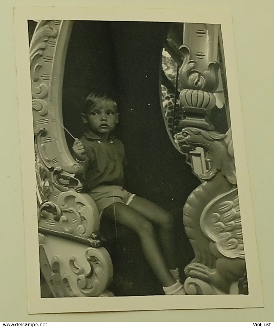 A Boy In A Decorative Carriage - Anonymous Persons