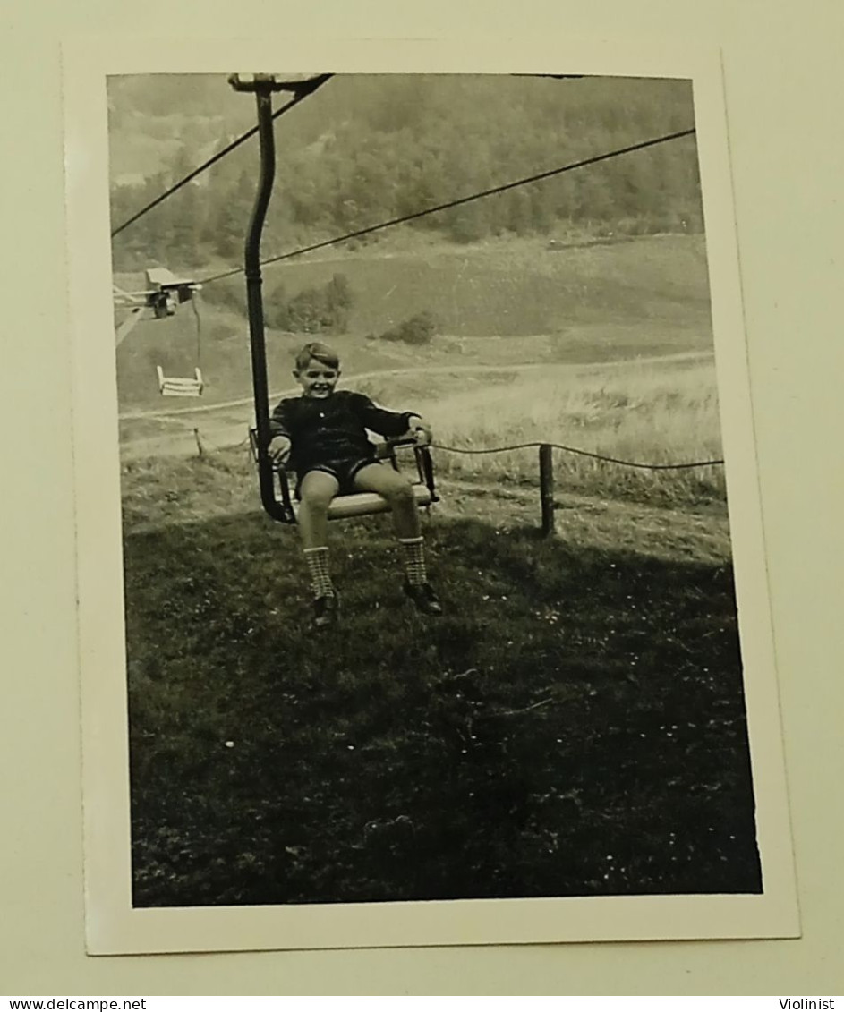 A Boy Rides A Cable Car - Anonymous Persons