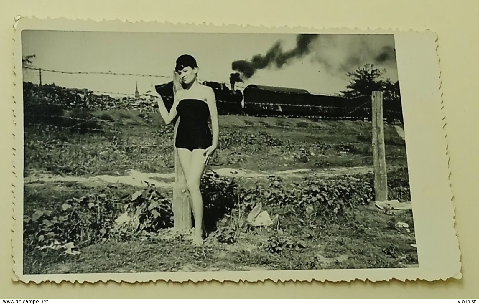 A Pretty Girl By The Fence As A Steam Locomotive Passes Behind - Anonymous Persons