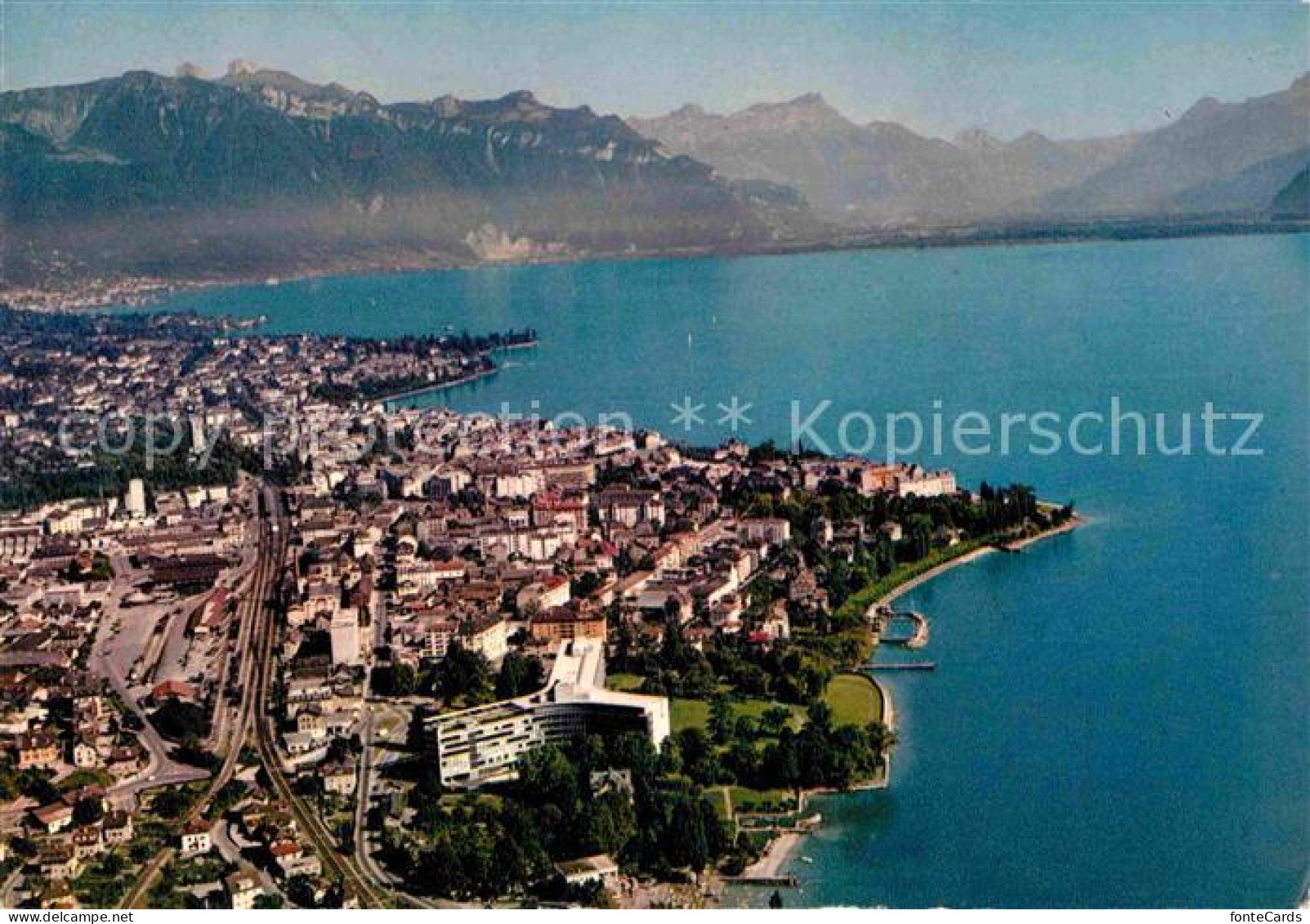 12825207 Vevey VD Batiment Nestle La Ville Lac Leman Et Les Dents Du Midi Vue Ae - Andere & Zonder Classificatie